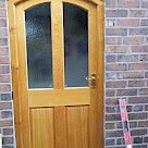 <p>Arched hardwood door & frame.</p>