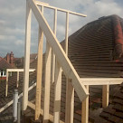 <p>The first dormer roof timbers start to be erected.</p>