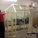 <p>Constructing the black house skeleton framework later at the show this will be clad in stone.</p>