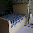 <p>A large bed with pull off side panels for storage underneath</p>