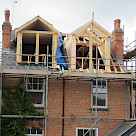 <p>Timber roof construction taking shape.</p>